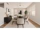 Formal dining room with modern decor, stylish lighting, and a large window at 19520 N 65Th Ave, Glendale, AZ 85308