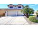 Two-story house with a two car garage and desert landscaping at 19520 N 65Th Ave, Glendale, AZ 85308