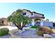 Two-story house with a landscaped front yard and palm trees at 19520 N 65Th Ave, Glendale, AZ 85308