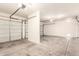 Spacious three car garage with garage doors and bright lighting at 19520 N 65Th Ave, Glendale, AZ 85308