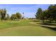 Scenic golf course view with lush greens and mature trees at 19520 N 65Th Ave, Glendale, AZ 85308