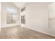 Bright living room featuring high ceilings, modern floors, and large windows at 19520 N 65Th Ave, Glendale, AZ 85308