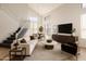 Bright living room with high ceilings, modern furnishings, and plenty of natural light at 19520 N 65Th Ave, Glendale, AZ 85308