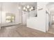 Spacious living room featuring a soaring ceiling, modern floors, and natural lighting at 19520 N 65Th Ave, Glendale, AZ 85308