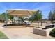 Shaded playground with modern play equipment at 19520 N 65Th Ave, Glendale, AZ 85308