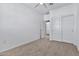 Spacious bedroom with carpeted floor, ceiling fan, and double door closet at 1959 E Hampton Ln # 102, Gilbert, AZ 85295