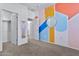 Bedroom with colorful accent wall, double door closet and mirror at 1959 E Hampton Ln # 102, Gilbert, AZ 85295