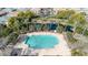 Community pool with surrounding lounge chairs and landscaping at 1959 E Hampton Ln # 102, Gilbert, AZ 85295