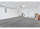 Spacious garage with concrete flooring and storage at 1959 E Hampton Ln # 102, Gilbert, AZ 85295