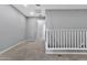 Upstairs hallway with carpeted flooring and white railing at 1959 E Hampton Ln # 102, Gilbert, AZ 85295