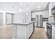 Open concept kitchen with island and stainless steel appliances at 1959 E Hampton Ln # 102, Gilbert, AZ 85295