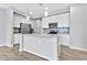 Modern kitchen with white cabinets, stainless steel appliances, and island at 1959 E Hampton Ln # 102, Gilbert, AZ 85295