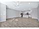 Open concept living room and kitchen with tile floors at 1959 E Hampton Ln # 102, Gilbert, AZ 85295