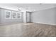 Spacious living room with wood-look floors and ceiling fan at 1959 E Hampton Ln # 102, Gilbert, AZ 85295