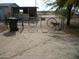 Property entrance features a rustic gate with decorative wagon wheels at 19805 W Encanto Blvd, Buckeye, AZ 85396