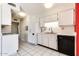 White kitchen with black appliances and ample counter space at 19811 N 130Th Ave, Sun City West, AZ 85375