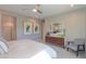 Inviting main bedroom features modern decor, neutral carpet, a ceiling fan, and natural light at 19920 N Wilford Ave, Maricopa, AZ 85138