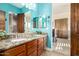 Bathroom with double vanity and teal walls at 21510 E Mewes Rd, Queen Creek, AZ 85142