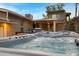 Backyard oasis boasts a modern hot tub, covered patio, and manicured desert landscaping at 2306 N 55Th St, Phoenix, AZ 85008