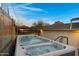 Relaxing backyard with a hot tub, decorative privacy wall and gorgeous desert views at 2306 N 55Th St, Phoenix, AZ 85008