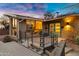 Attractive home showcasing its vibrant blue door, brick facade, and xeriscaping at 2306 N 55Th St, Phoenix, AZ 85008
