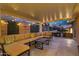 Spacious covered patio with comfortable seating and modern outdoor kitchen setup, perfect for entertaining at 2306 N 55Th St, Phoenix, AZ 85008