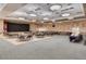 Spacious banquet hall with tables, chairs, stage, and buffet setup at 2306 N Floyd Dr, Mesa, AZ 85215