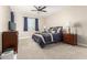 Calm bedroom with a ceiling fan, a double bed, neutral paint, and lots of natural light at 2306 N Floyd Dr, Mesa, AZ 85215