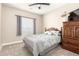 Comfortable bedroom featuring a bed, a ceiling fan, natural light, and neutral paint at 2306 N Floyd Dr, Mesa, AZ 85215