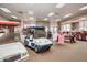 Golf carts parked inside a golf pro shop with apparel and equipment at 2306 N Floyd Dr, Mesa, AZ 85215