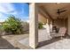 Covered patio featuring retractable sunshades, paver flooring, and neutral outdoor furniture at 2306 N Floyd Dr, Mesa, AZ 85215