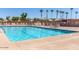 Swimming pool with lounge chairs and desert landscaping in the background at 2306 N Floyd Dr, Mesa, AZ 85215