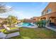 Relaxing backyard oasis with a pool, lawn area, and patio at 2404 E Gillcrest Rd, Gilbert, AZ 85298