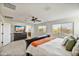 Main bedroom with king-size bed and ensuite bathroom access at 2404 E Gillcrest Rd, Gilbert, AZ 85298