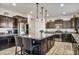 Modern kitchen with island, stainless steel appliances, and ample cabinetry at 2404 E Gillcrest Rd, Gilbert, AZ 85298