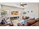 Spacious living room featuring comfortable seating and large TV at 2404 E Gillcrest Rd, Gilbert, AZ 85298