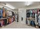 Large walk-in closet with ample shelving and hanging space at 2404 E Gillcrest Rd, Gilbert, AZ 85298