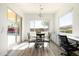 Bright dining area with large windows, sliding door and backyard views at 26921 N 100Th Ave, Peoria, AZ 85383
