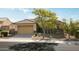 Beautiful single-story home with a well-maintained front yard and a two-car garage at 26921 N 100Th Ave, Peoria, AZ 85383