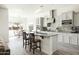 Modern kitchen with granite countertops, stainless steel appliances, and a center island at 26921 N 100Th Ave, Peoria, AZ 85383