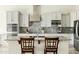 Close up of a modern kitchen with granite countertops and stainless steel appliances at 26921 N 100Th Ave, Peoria, AZ 85383