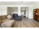 Bright, open living area with wood floors, neutral decor, and versatile layout for modern living at 26921 N 100Th Ave, Peoria, AZ 85383