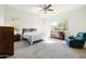 Spacious main bedroom boasts a ceiling fan, large windows, and ample natural light at 26921 N 100Th Ave, Peoria, AZ 85383