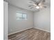 Light and airy bedroom with wood-like tile floors at 2918 E Laurel Ln, Phoenix, AZ 85028