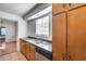 Kitchen features wood cabinets and a double sink at 308 N Washington St, Chandler, AZ 85225