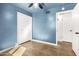 Blue bedroom with double door closet and concrete floors at 321 W Palo Verde St, Gilbert, AZ 85233
