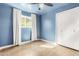 Bedroom with blue walls, ceiling fan and concrete floors at 321 W Palo Verde St, Gilbert, AZ 85233
