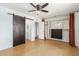 Bright bedroom featuring a barn door, ceiling fan, and built-in closet at 321 W Palo Verde St, Gilbert, AZ 85233