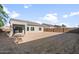 Large backyard features an undeveloped landscape and a covered patio at 3218 N Lafayette Dr, Florence, AZ 85132