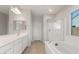 Bathroom featuring double vanity, bathtub, and separate glass enclosed shower at 3218 N Lafayette Dr, Florence, AZ 85132
